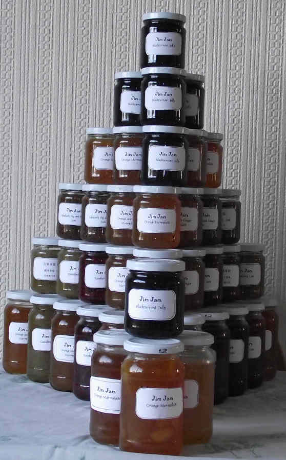 a pyramid of stacked jars of jam
