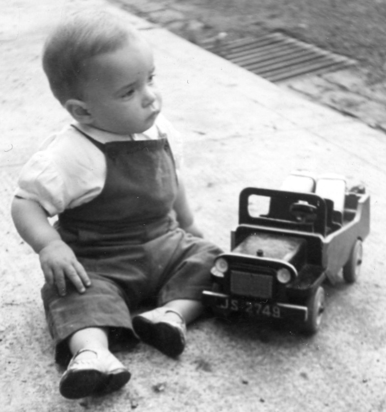 toddler with model jeep